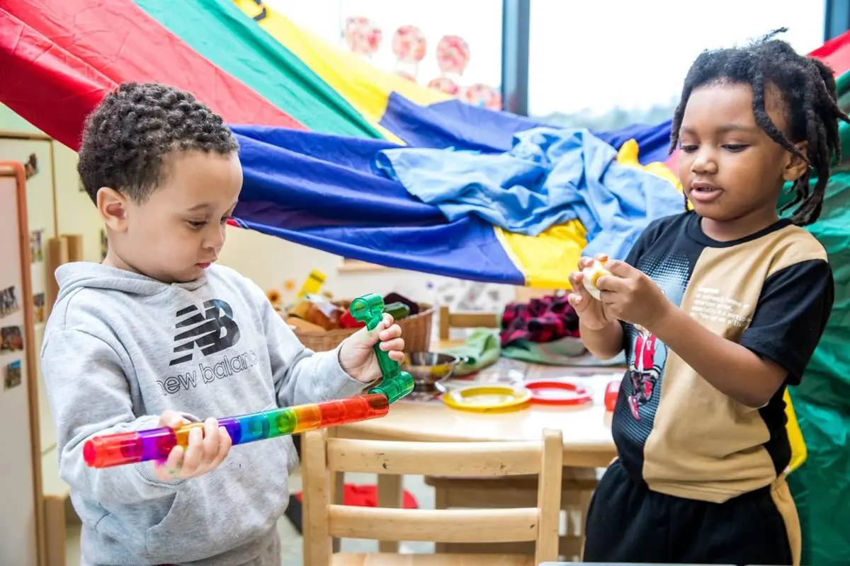 Children Playing in Playspace with Toys